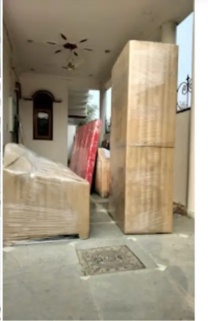 Almirah and furniture packed for home shifting