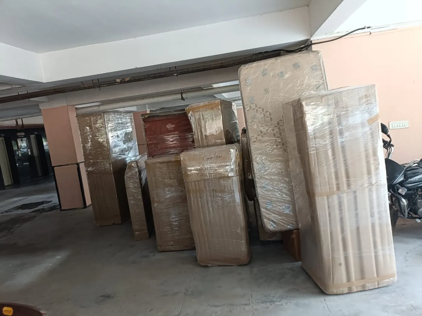 Om Packers team with packed household goods ready for loading in Gurgaon