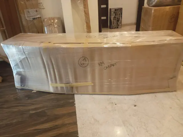 Bed headboard packed in cardboard for safe transit