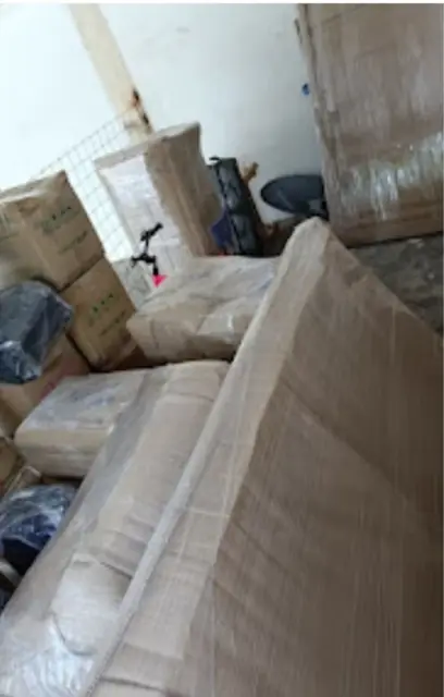 Sofa wrapped in protective packing material