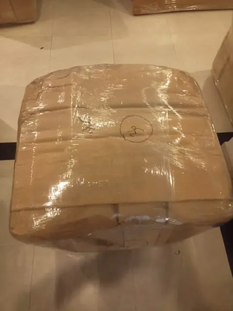 Table packed in cardboard and stretch film
